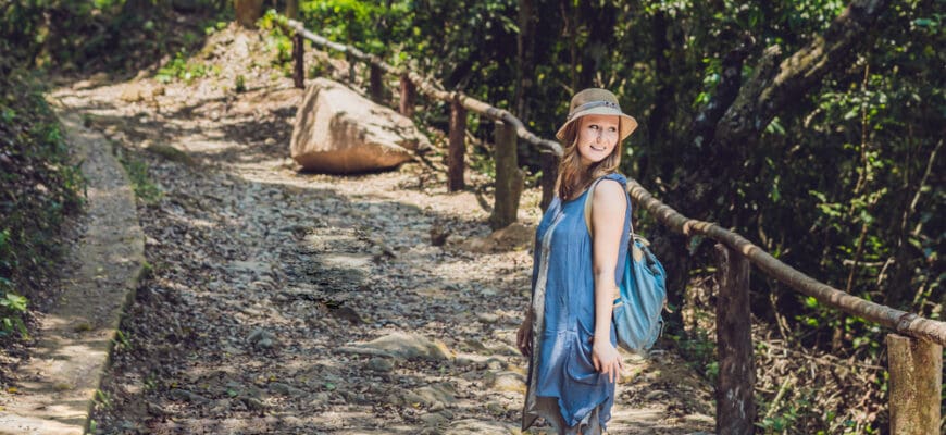 A,Young,Woman,Is,Standing,On,Forest,Road.